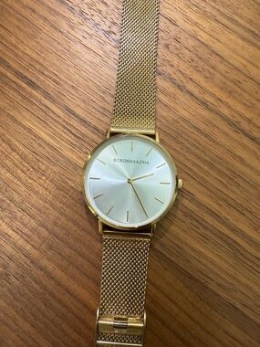 BCBGMaxAzria Gold Mesh Strap Watch with Sunray Dial